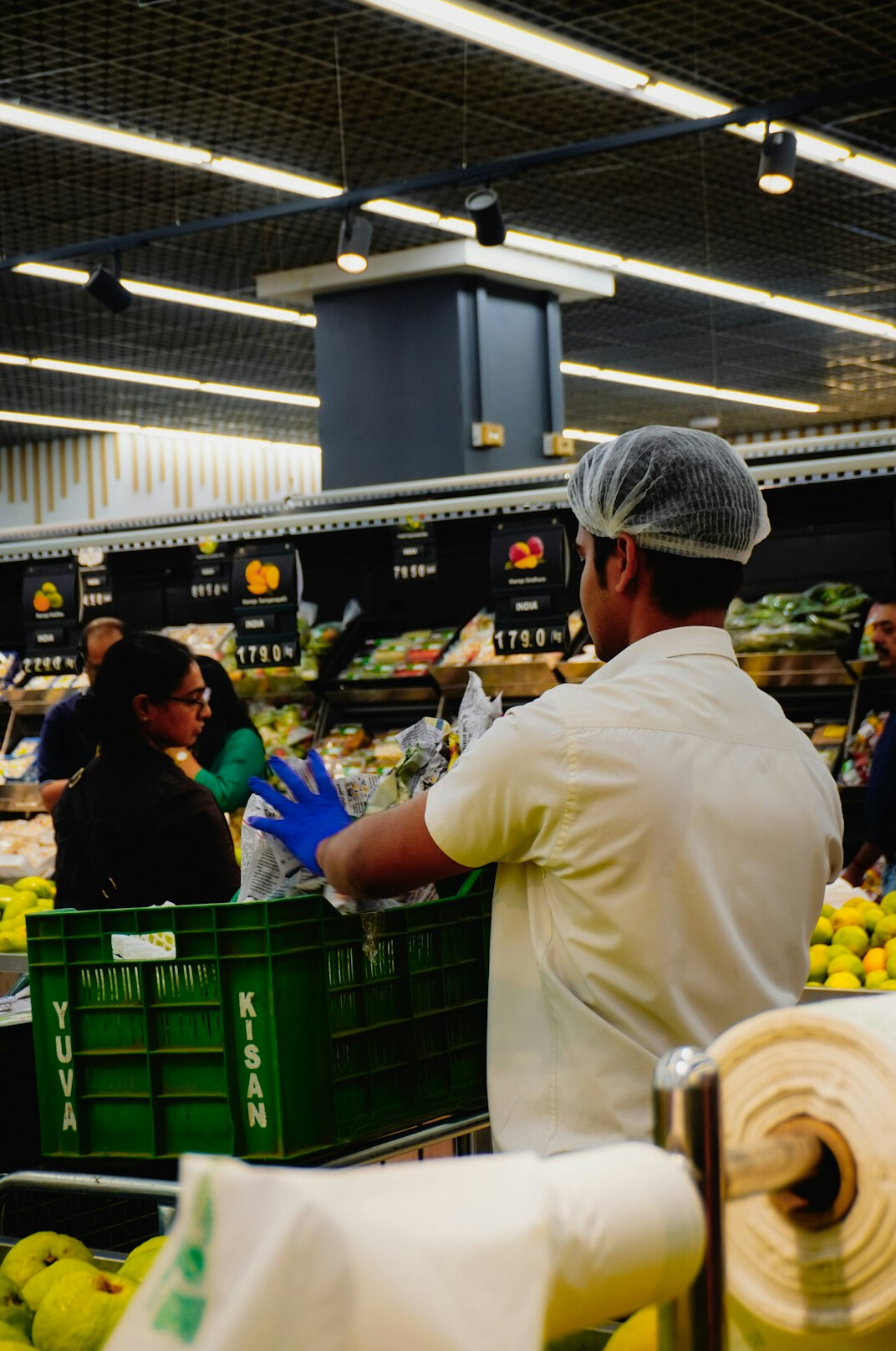 group of shoppers in produce section